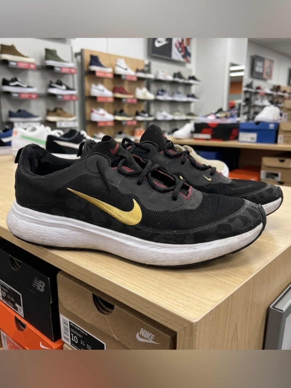 Nike Men’s Black Athletic Sneakers with Gold Swoosh 2021